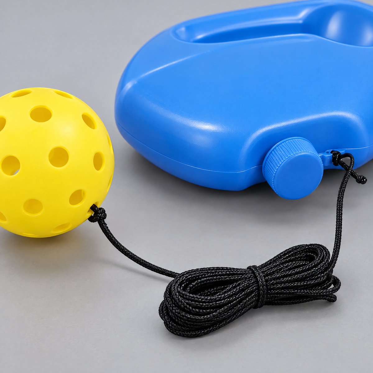Close-up of the rebounder trainer's tether and ball attachment